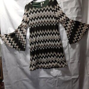 Elegant  chevron-patterned sheath dress featuring statement bell sleeves